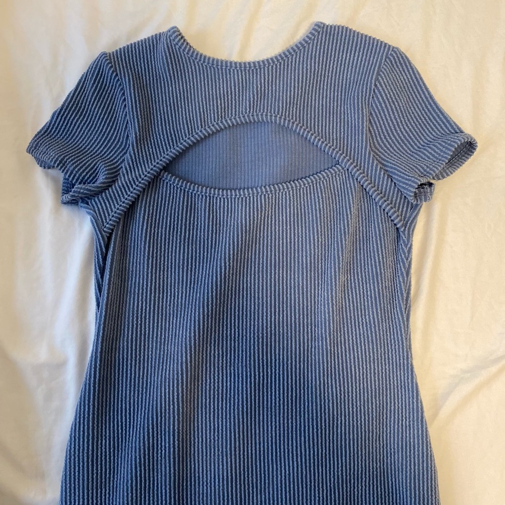 Beautiful blue ripped dress. Compliments figure well!
